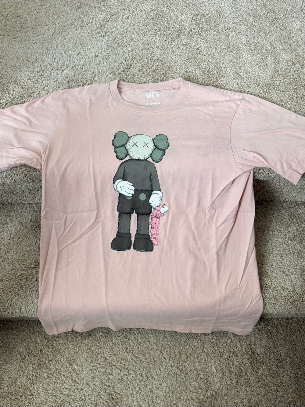 Uniqlo x KAWS Pink Graphic Tee with Black Character Print